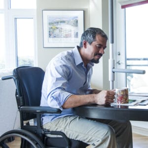 Man sitting at the table with a SuperBar beside him