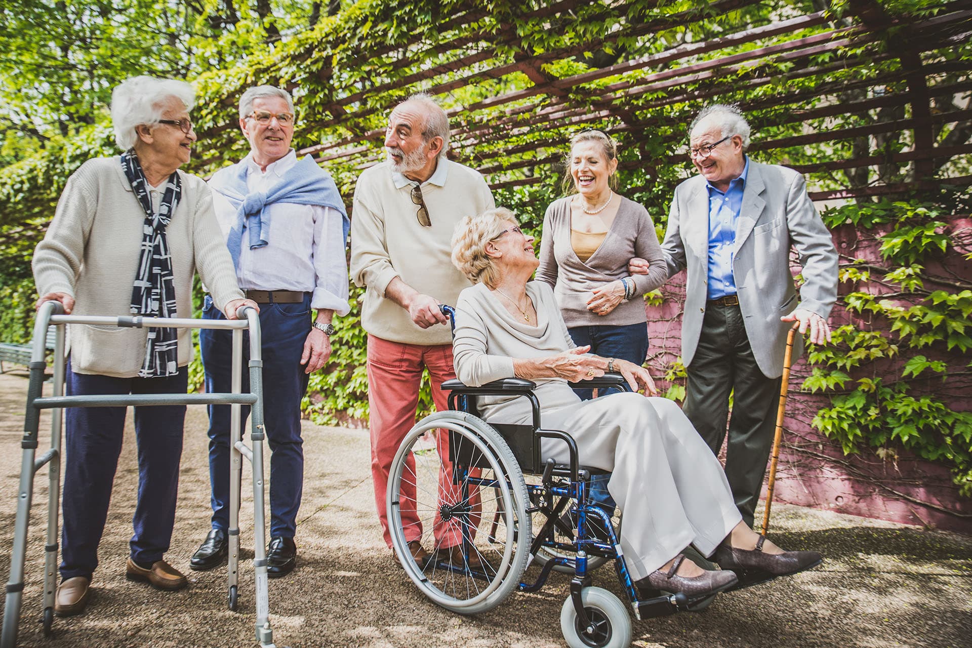 Group of elderly people talking together outside