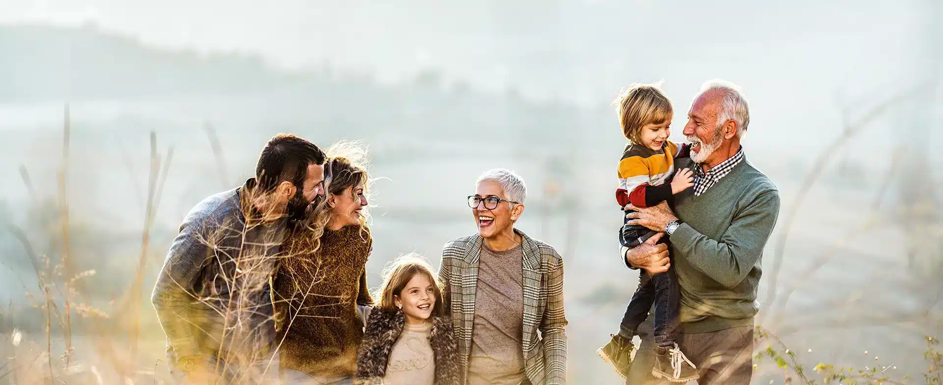 3 generations of a family enjoying a walk outside together.