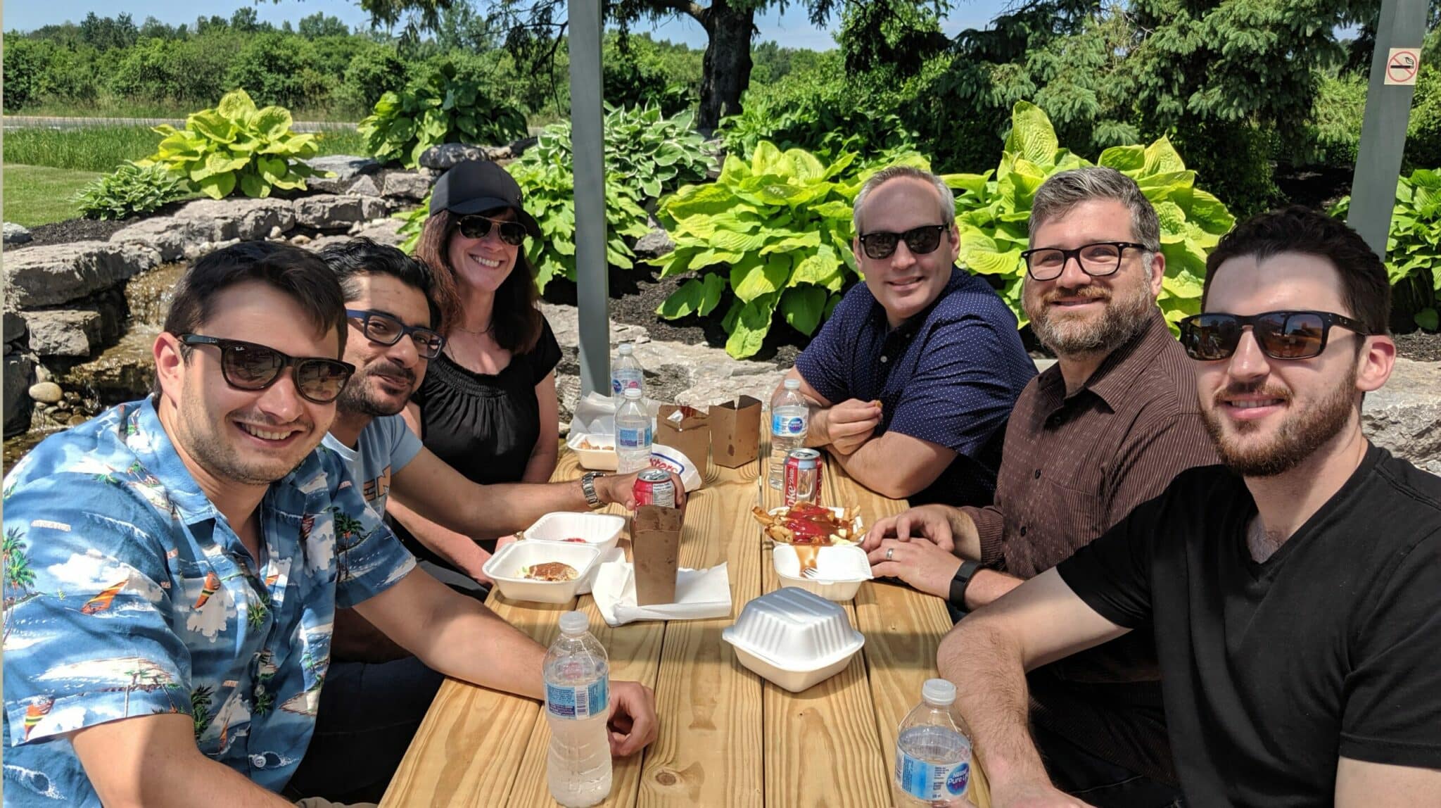 Employees outside at a company function.