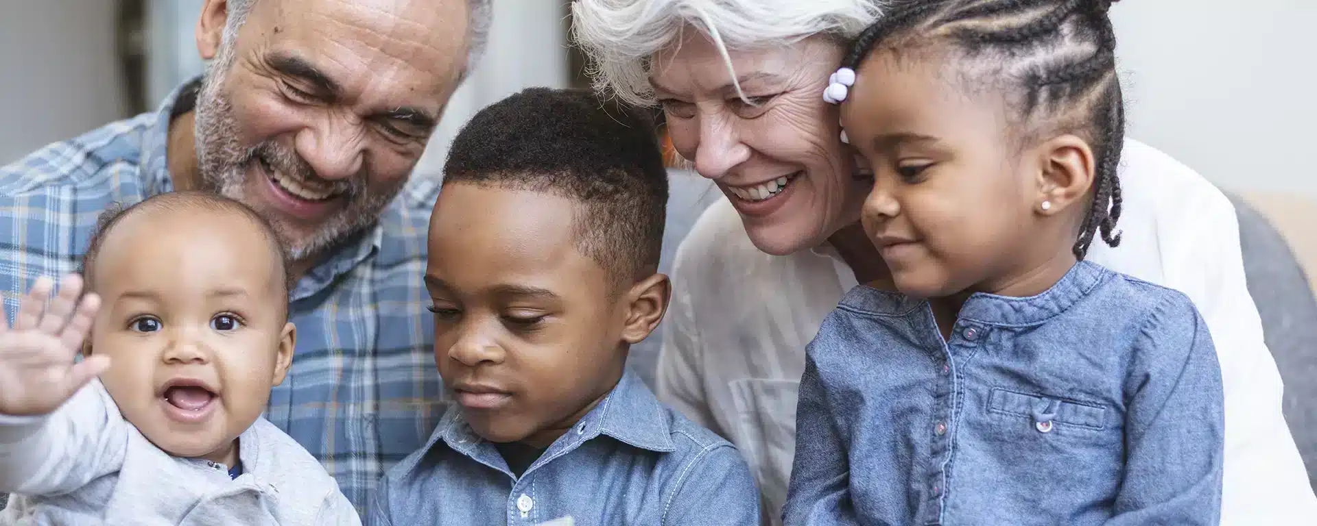 Grandparents reading to their grandchildren